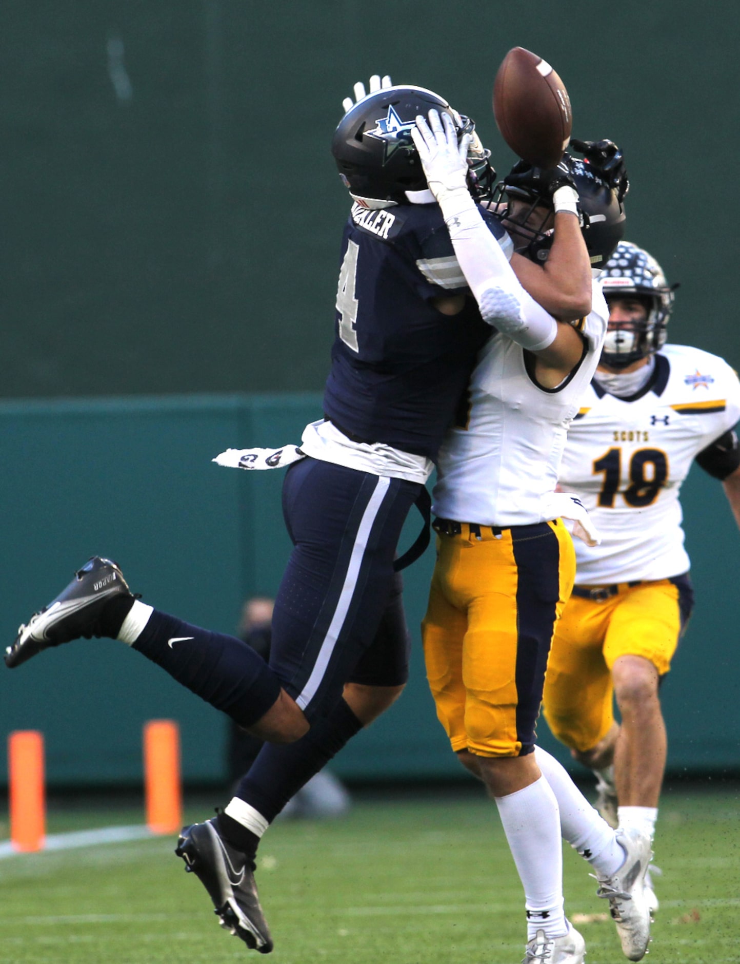 Frisco Lone Star receiver Trace Bruckler (4) battles with Highland Park defensive back...