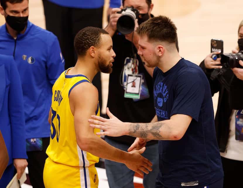Dallas Mavericks guard Luka Doncic (77) and Golden State Warriors guard Stephen Curry (30)...