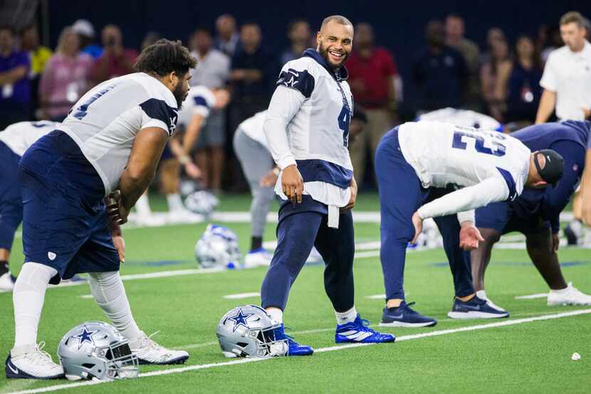 Dallas Cowboys quarterback Dak Prescott (4) smiles during a Dallas Cowboys training camp...