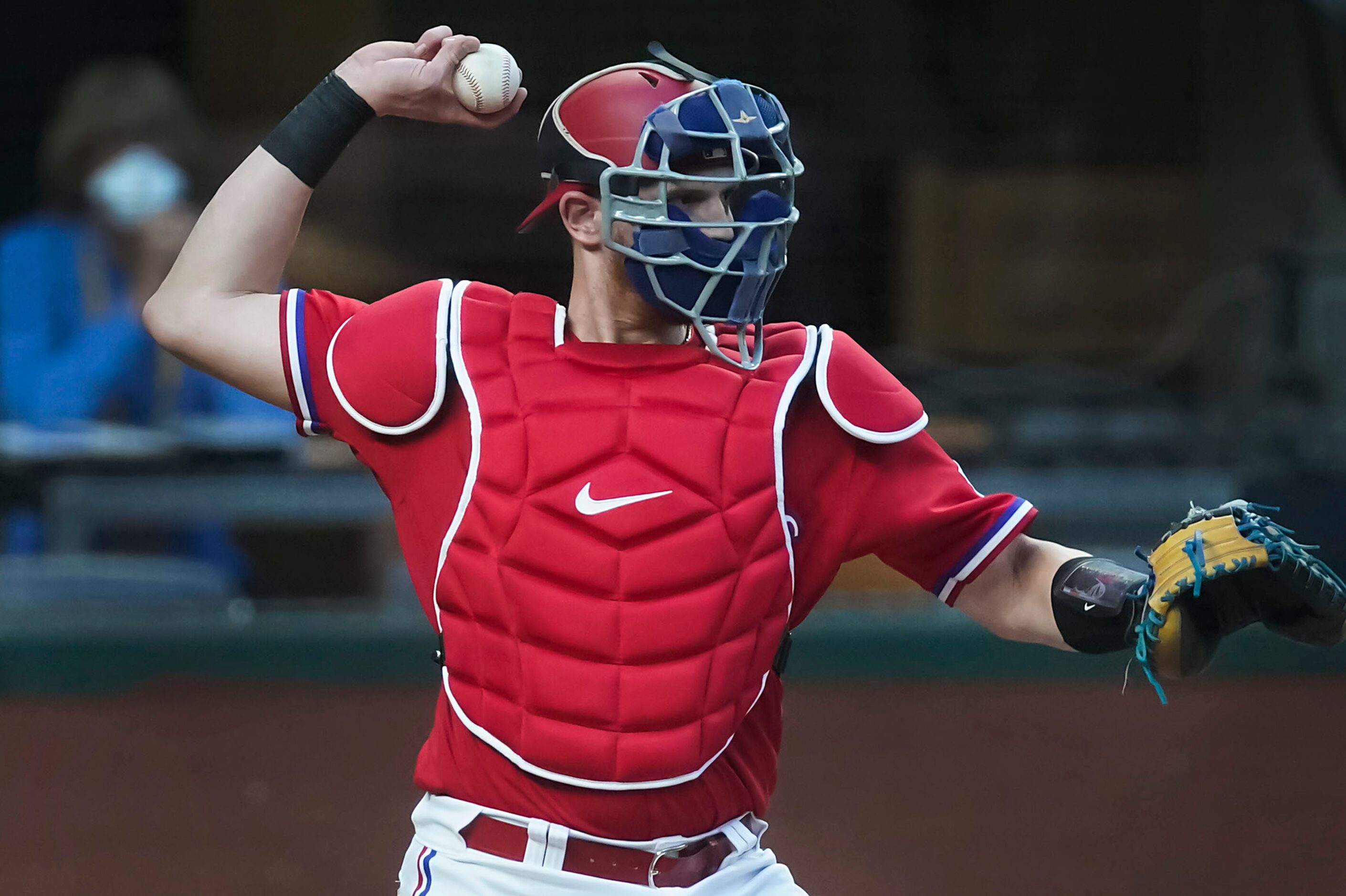 Texas Rangers catcher Sam Huff makes a warmup throw during the first inning against the...