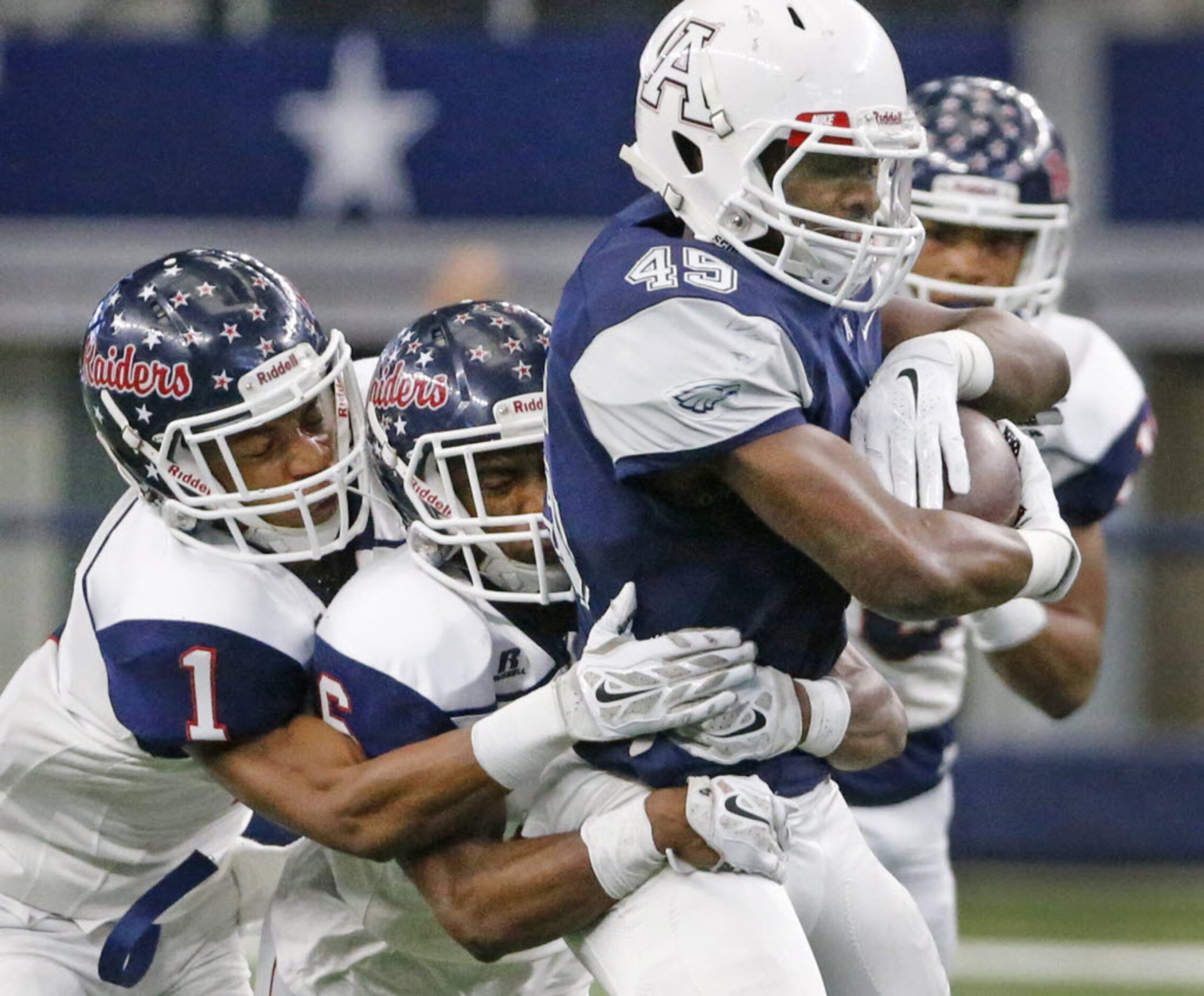 Allen running back Kirby Bennett (45) rumblers for yardage a s host of Ryan defenders...