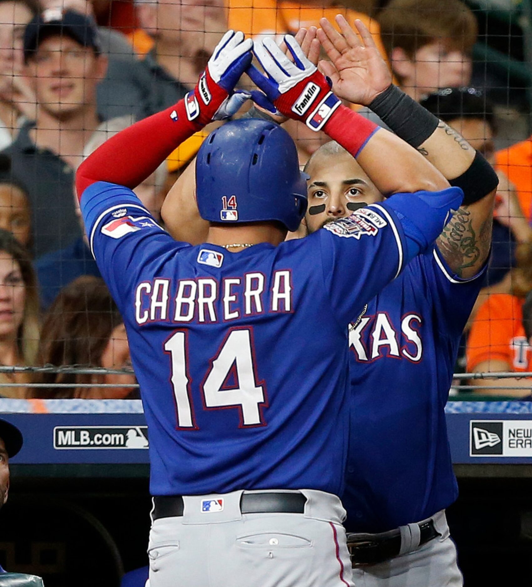 HOUSTON, TEXAS - JULY 19: Asdrubal Cabrera #14 of the Texas Rangers receives congratulations...