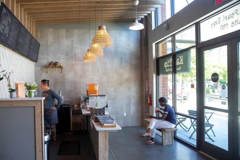 The bamboo baskets that hang above the counter at Ka-Tip are fish traps from Thailand.