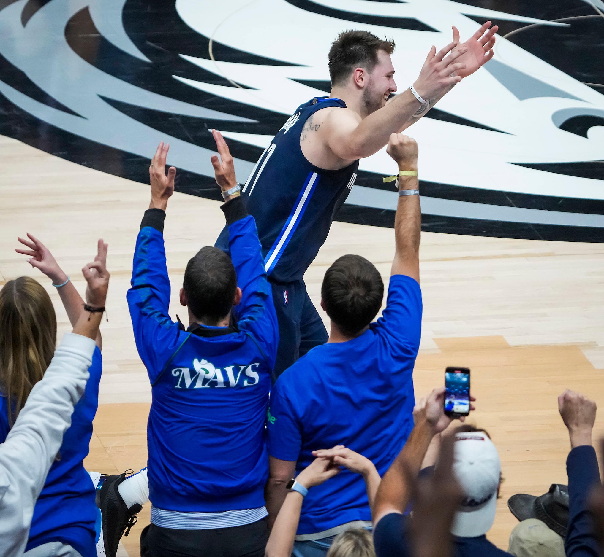 Dallas Mavericks guard Luka Doncic (77) celebrates after hitting a 3-pointer during the...