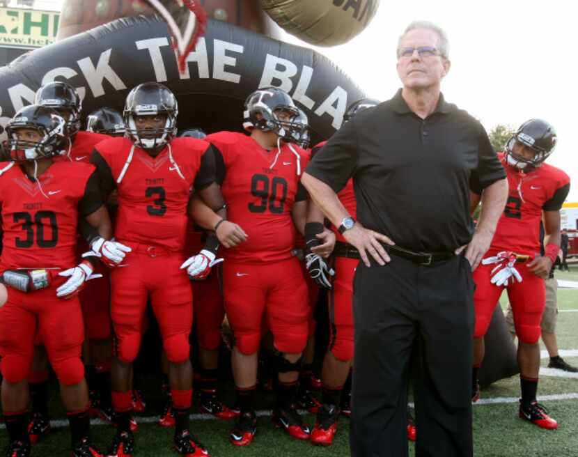 Trinity head coach Steve Lineweaver and his team prepare to take the field against Abilene...