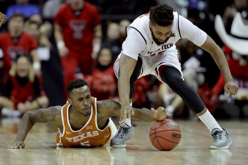 Texas' Kendal Yancy (5) and Texas Tech's Aaron Ross (15) chase a loose ball during the...