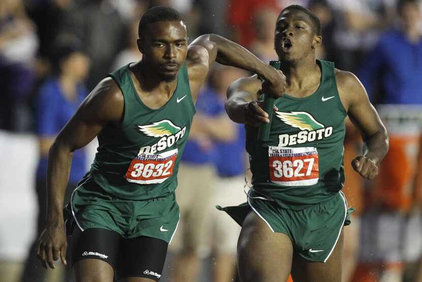 DeSoto's London Dunn (3632) takes the baton from LaDarren Brown (3627) in the class 6A boys...