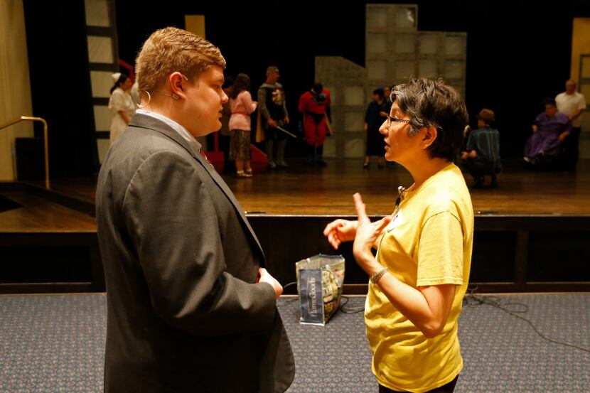 Director Lisa Schmidt (right) talks with Michael Susans, who is playing his dream role of...