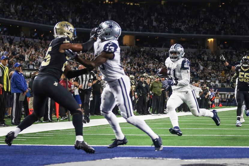 Dallas Cowboys running back Ezekiel Elliott (21) runs the ball to score a touchdown during...