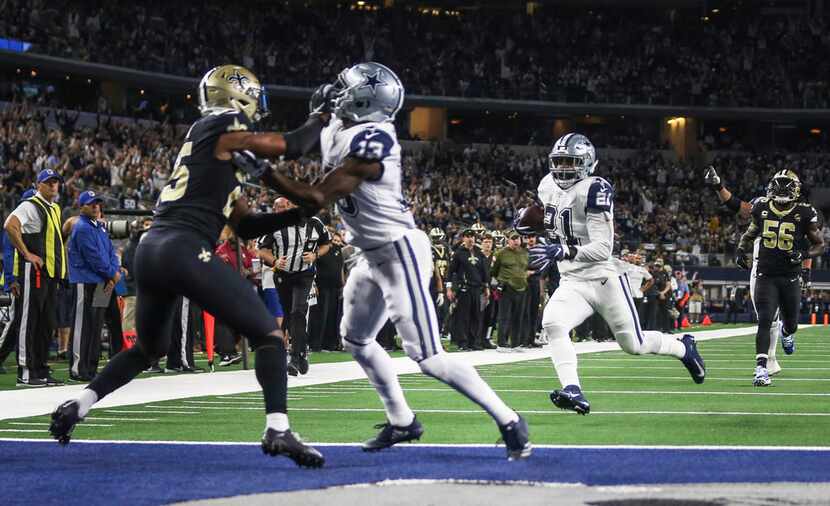 Dallas Cowboys running back Ezekiel Elliott (21) runs the ball to score a touchdown during...