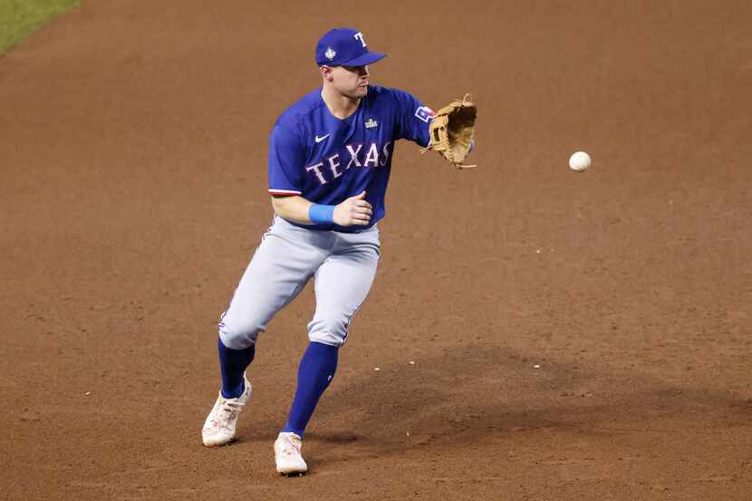 Texas Rangers third baseman Josh Jung (6) fields a hit by Arizona Diamondbacks’ Lourdes...
