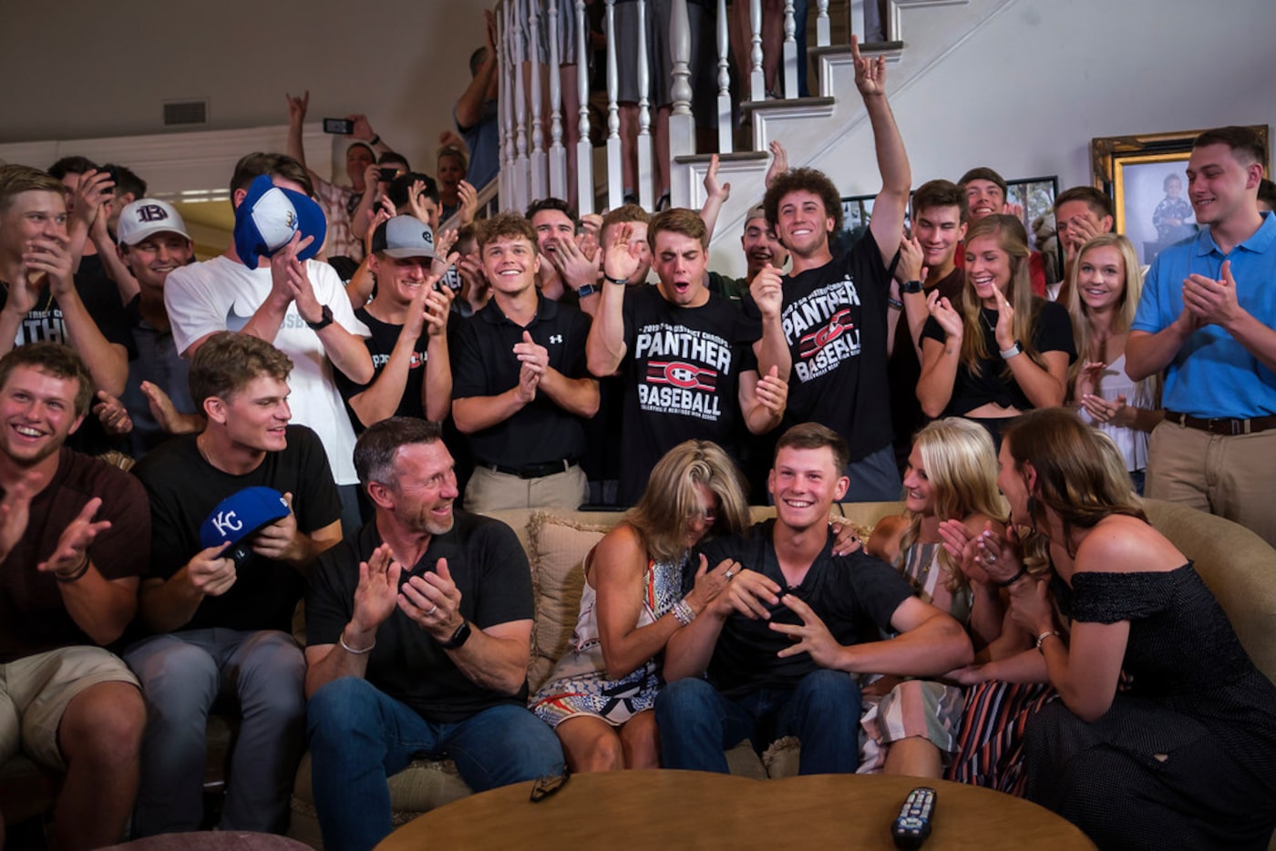 Bobby Witt Jr. (third from right) celebrates during a Major League Baseball draft night...