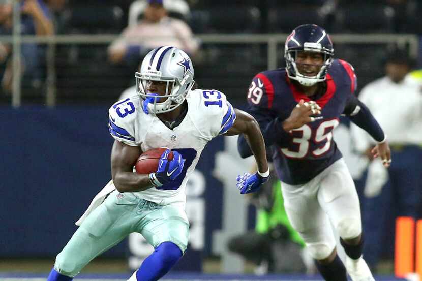 Dallas Cowboys wide receiver Lucky Whitehead (13) is on the run from Houston Texans safety...