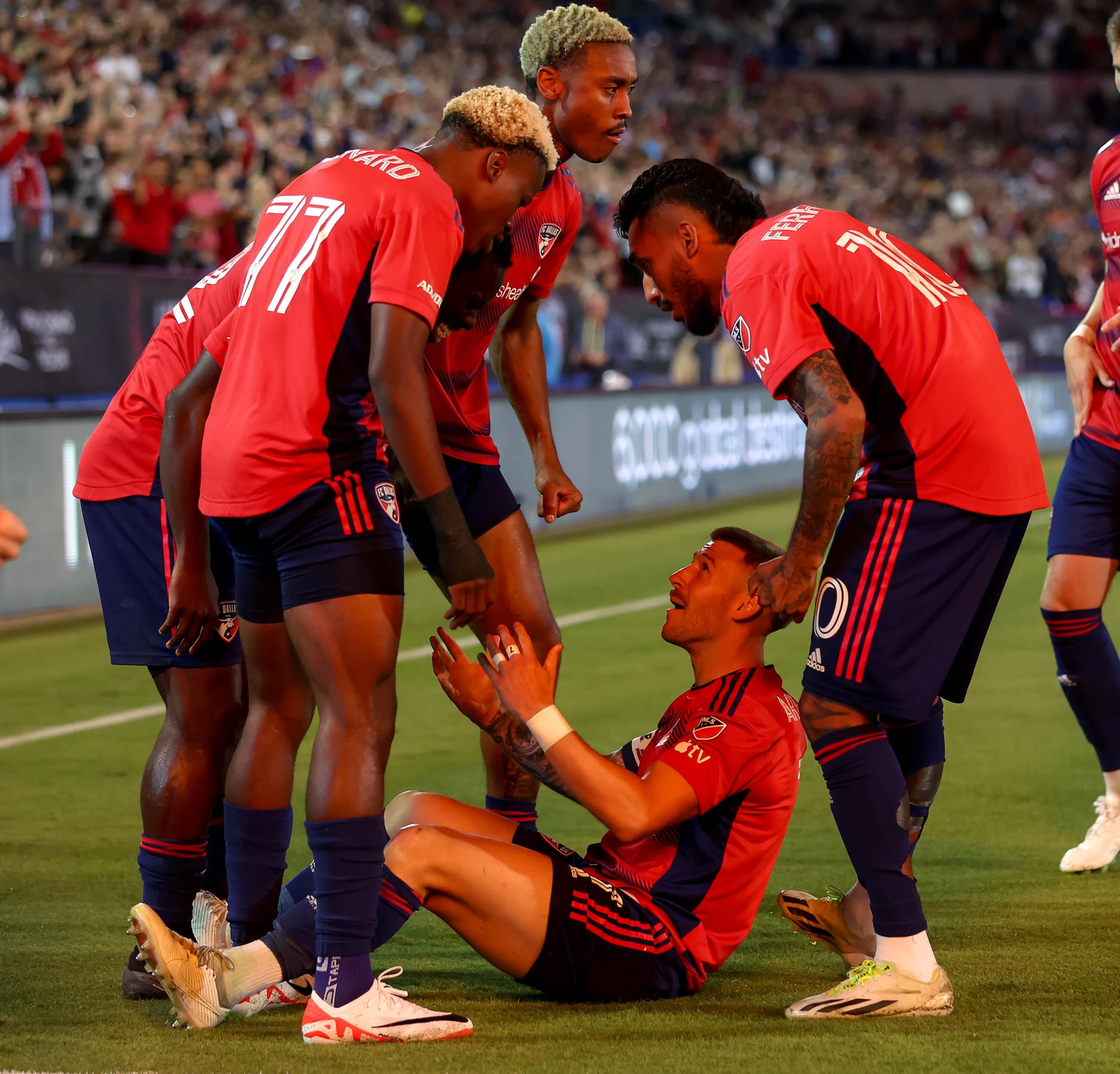 FC Dallas Paul Arriola (center) celebrates with his teammates after scoring a goal against...