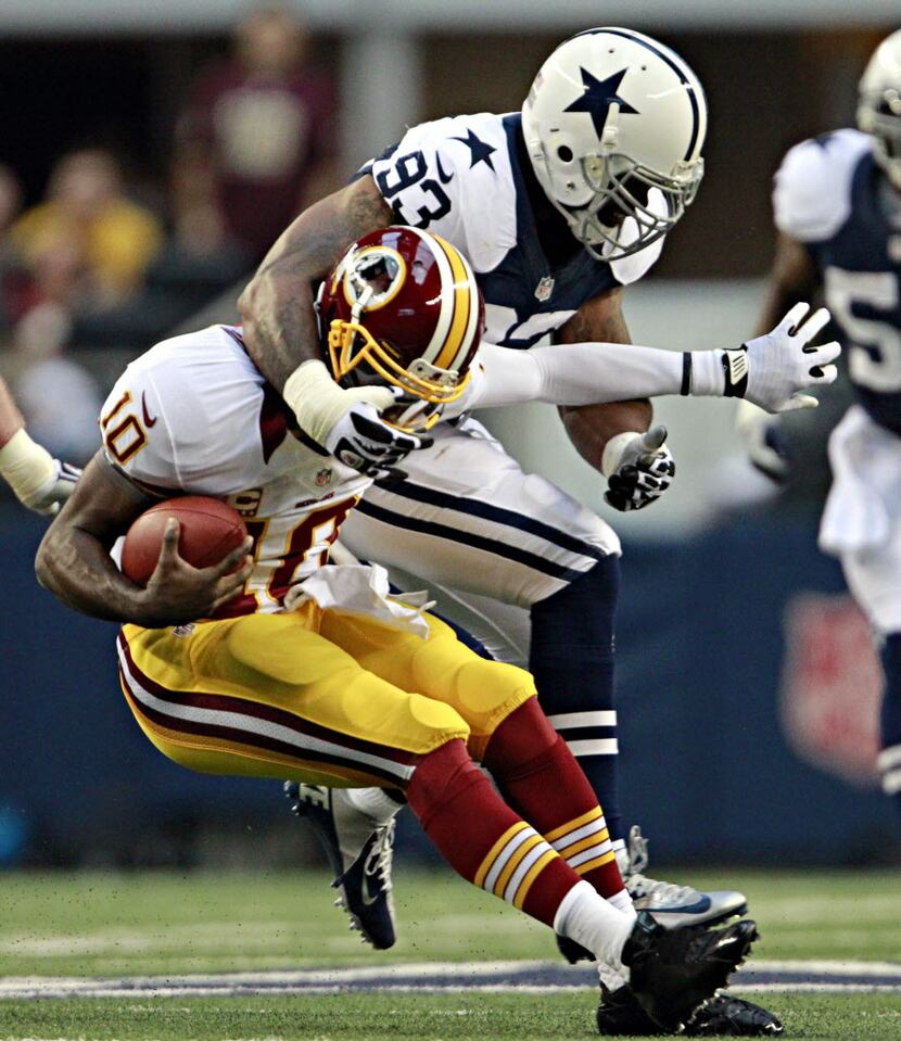 Dallas Cowboys outside linebacker Anthony Spencer (93) sacks Washington Redskins quarterback...