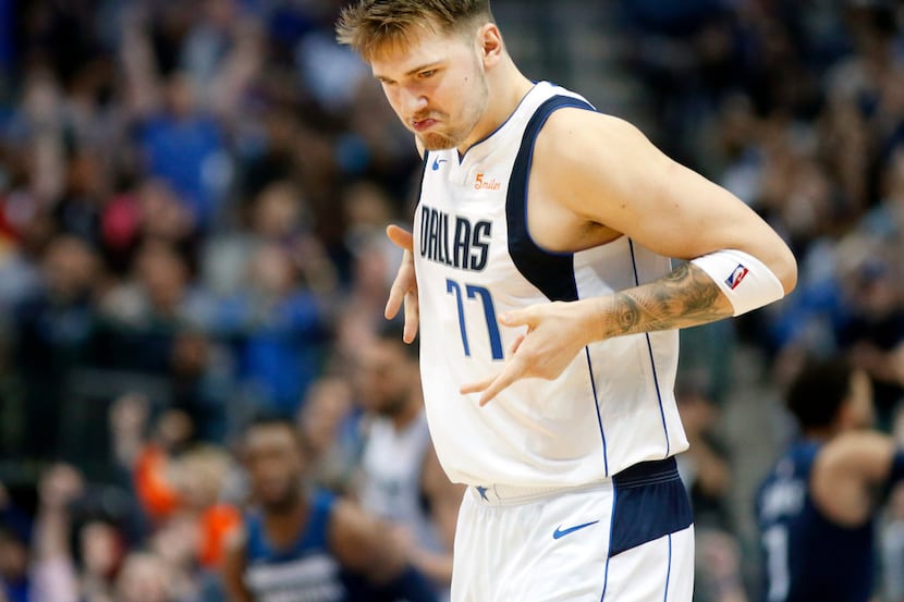 Dallas Mavericks forward Luka Doncic (77) reacts after hitting a late fourth quarter...