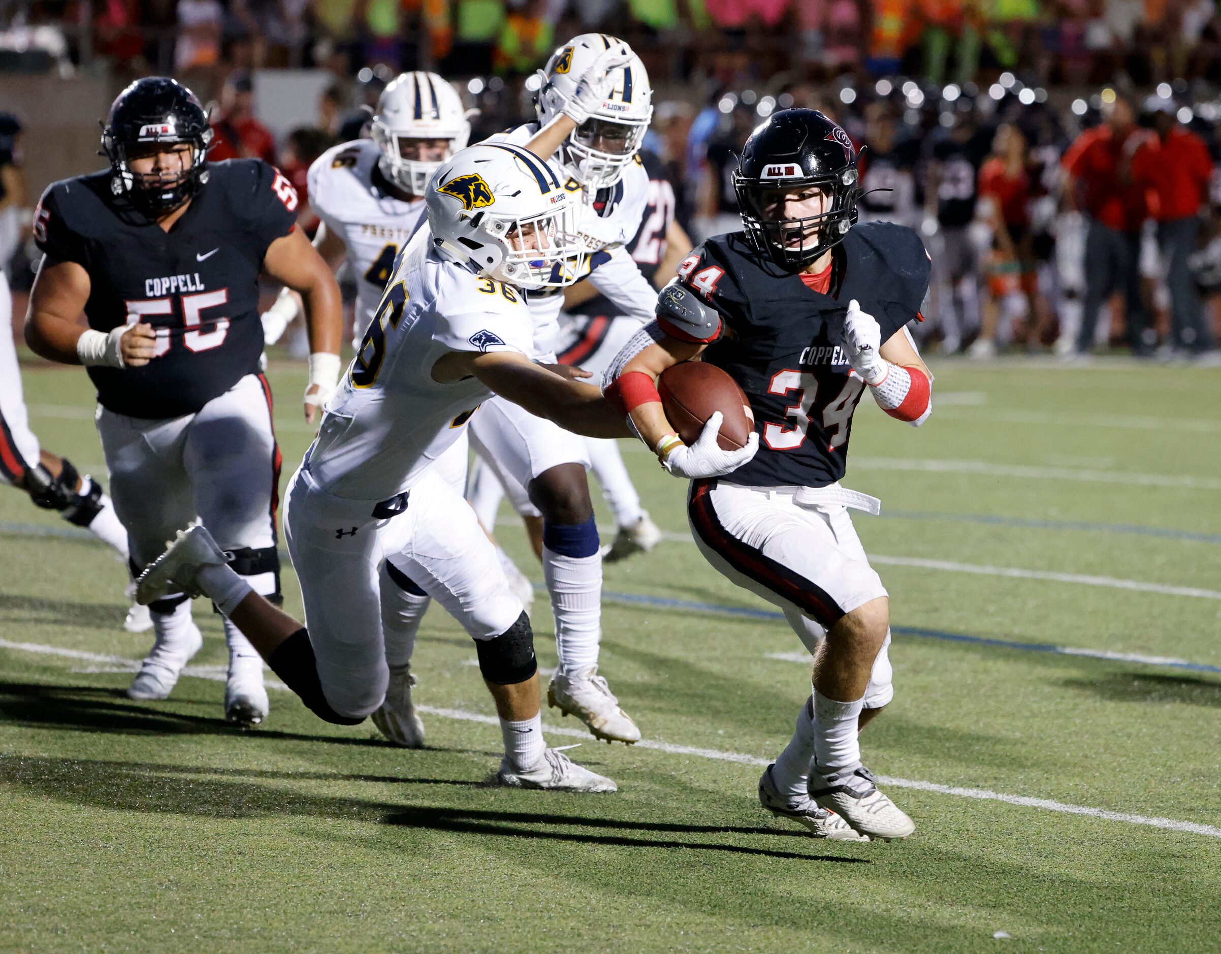 Coppell’s Blake Robbins gets past Prestonwood Christian Academy defender Caleb Bowers (36)...