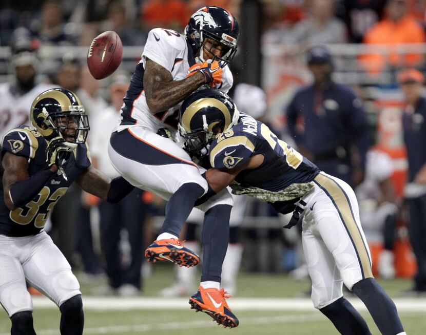 St. Louis Rams strong safety T.J. McDonald, right, breaks up a pass intended for Denver...