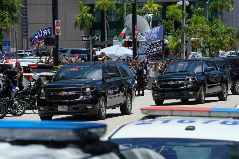 The motorcade carrying former President Donald Trump arrives at the Wilkie D. Ferguson Jr....