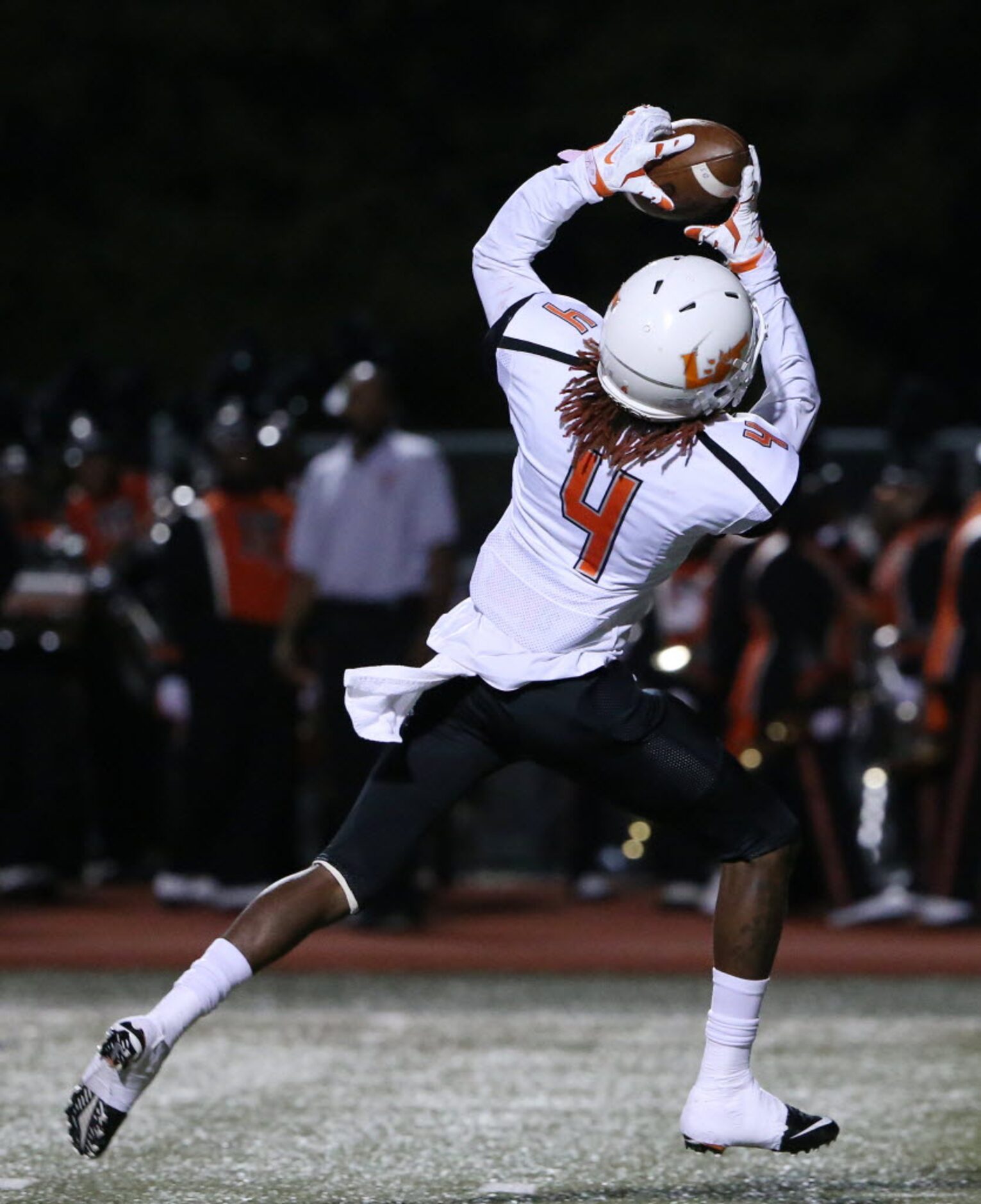 Lancaster wide receiver Mark Mims (4) catches a pass for a touchdown to make the score 13-21...