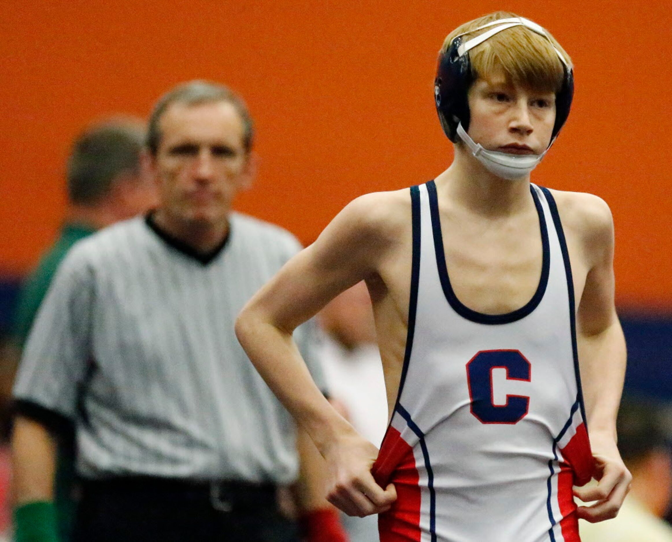 Tyten Volk of Frisco Centennial High School takes the mat for his championship match in the...