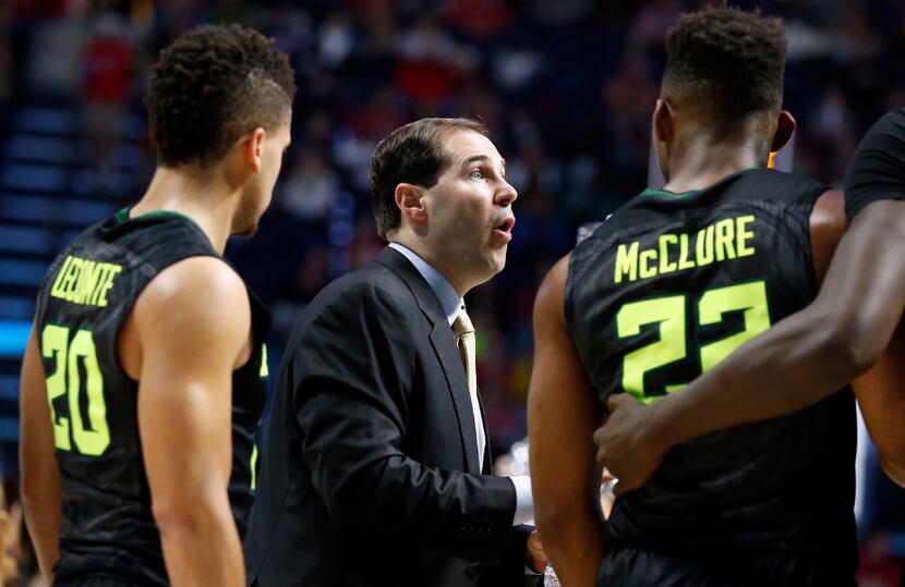 Baylor head coach Scott Drew speaks to his players guards Manu Lecomte (20) and King McClure...