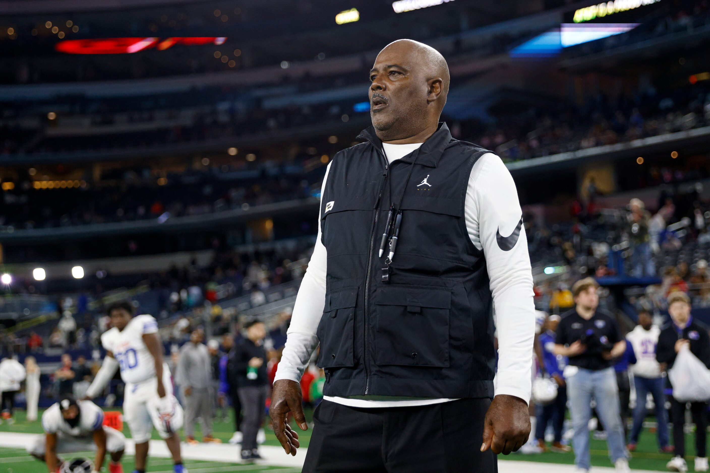 Duncanville head coach Reginald Samples watches the Galena Park North Shore team celebrate...