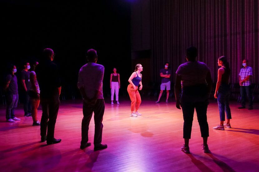 Lena Oren (center) leads audience members and fellow dancers during a performance of “The...