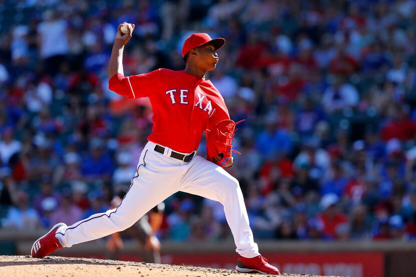 Texas Rangers relief pitcher Jose Leclerc (25) throws against the Houston Astros in the...