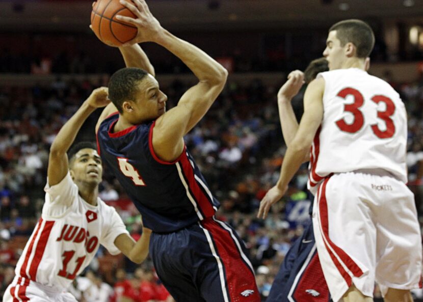 Allen forward Jamuni McNeace (4) grabs a rebound in front of Converse Judson guard Rayshon...