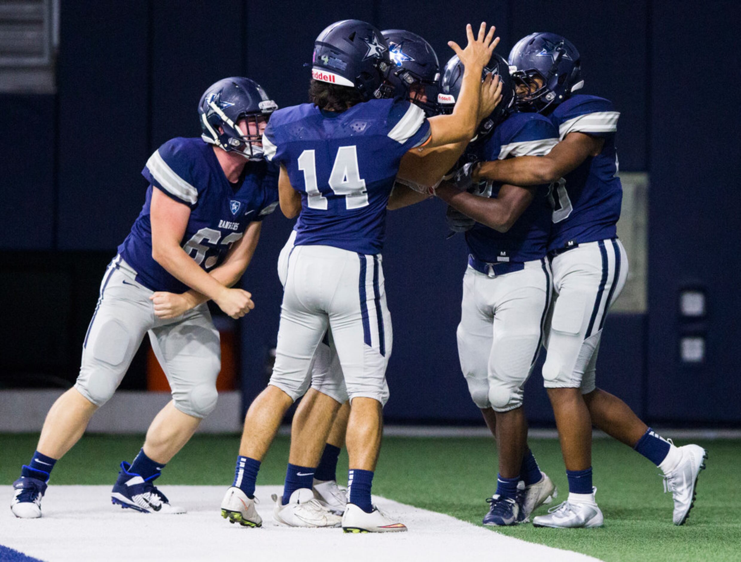 Frisco Lone Star running back Fogo Sokoya (28) celebrates a touchdown with his team during...
