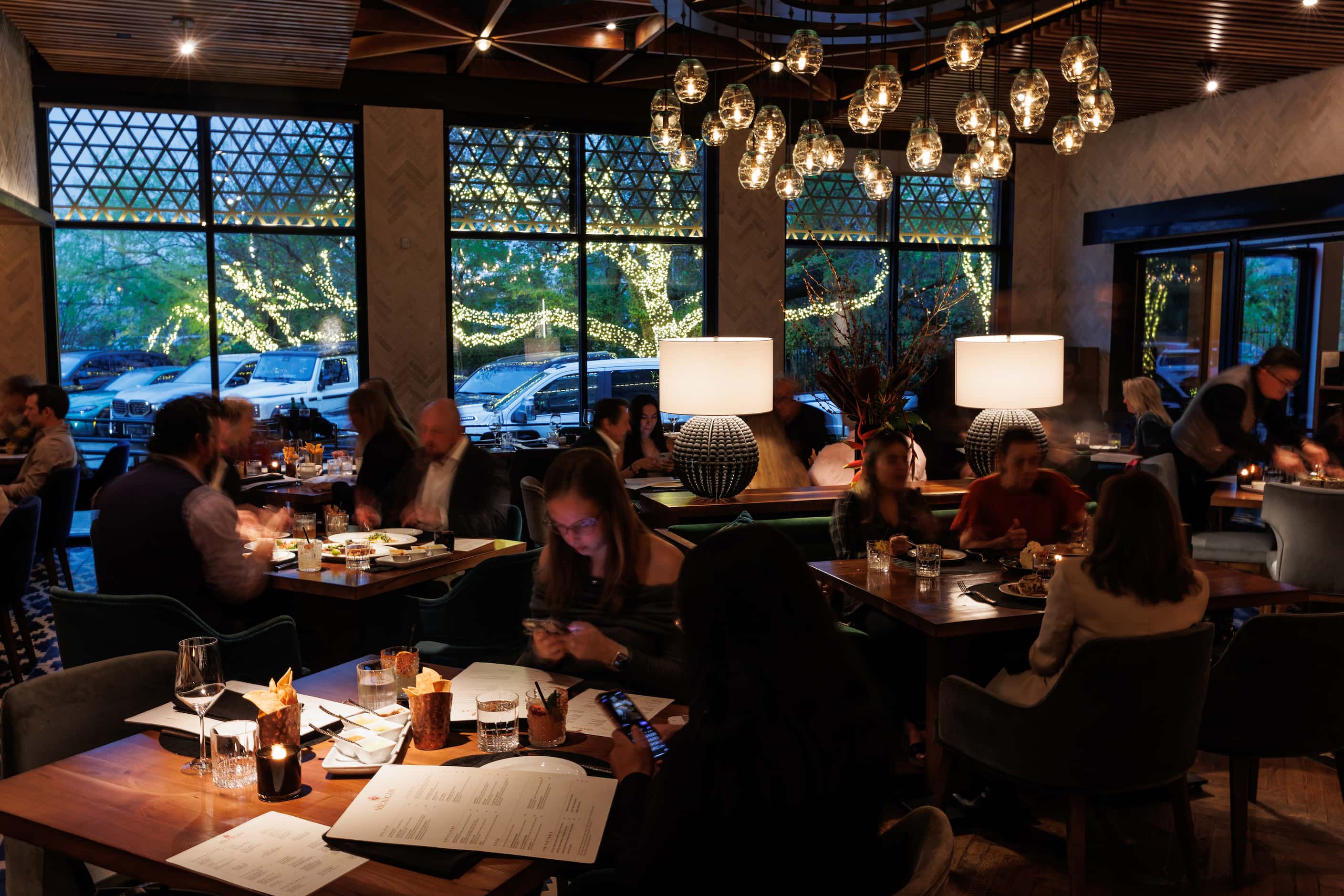The front dining room at The Mexican shows a view out toward Turtle Creek Boulevard in the...