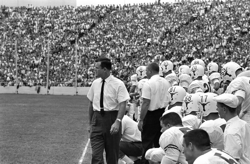 Coach Darrell Royal, left, and team members of the University of Texas had eyes for only...