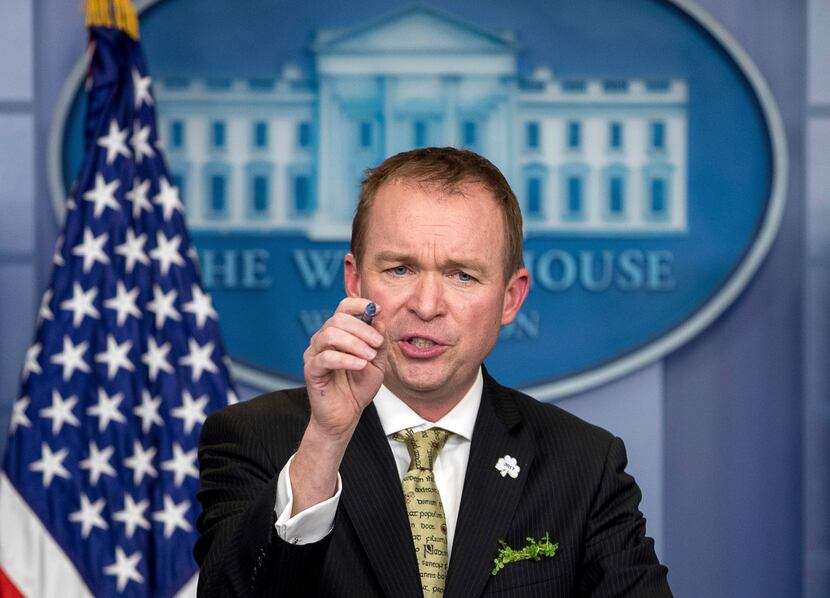 In this March 16, photo, White House budget director Mick Mulvaney speaks at the White...