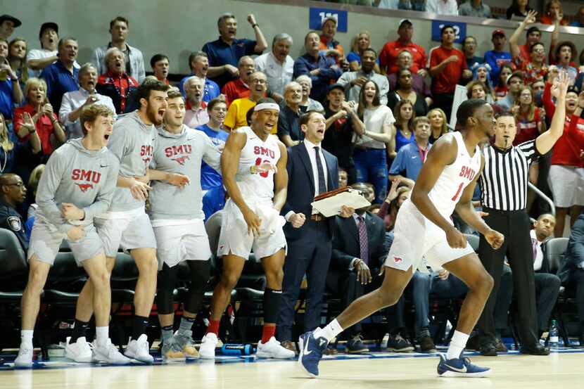 Southern Methodist Mustangs bench erupts after teammate Shake Milton (1) made a three...