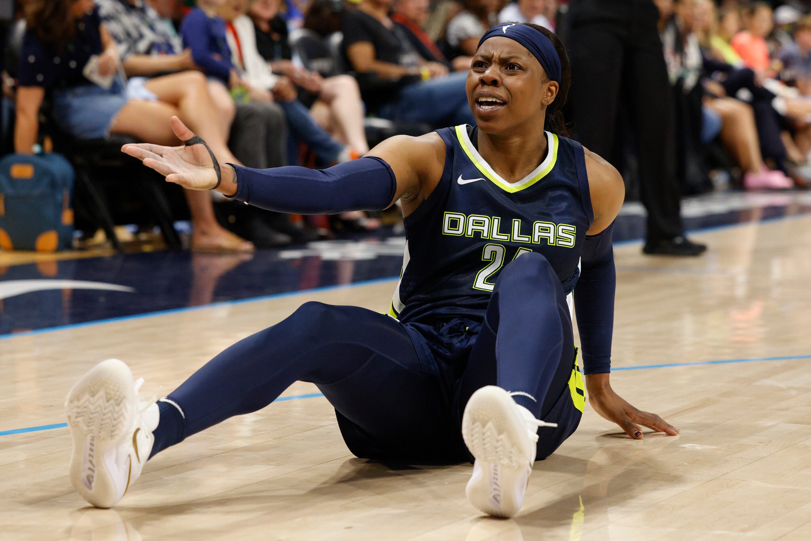 Dallas Wings guard Arike Ogunbowale (24) reacts after a foul call during the first half...