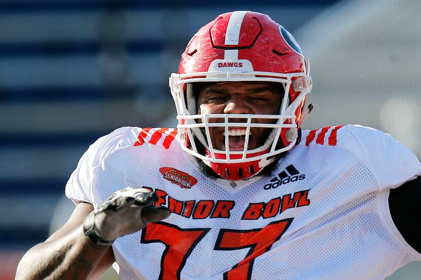 South Squad offensive guard Isaiah Wynn, of Georgia, reacts to a drill during the South...