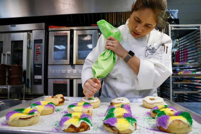 Owner Tida Pichakron ices miniature king cakes at Haute Sweets Patisserie in Dallas.