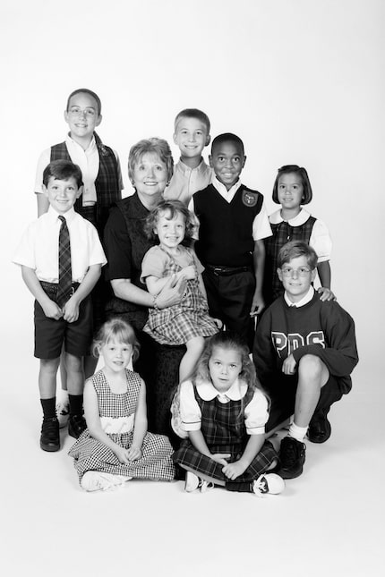 Gloria Snyder poses with some of her students at Parish Episcopal School.