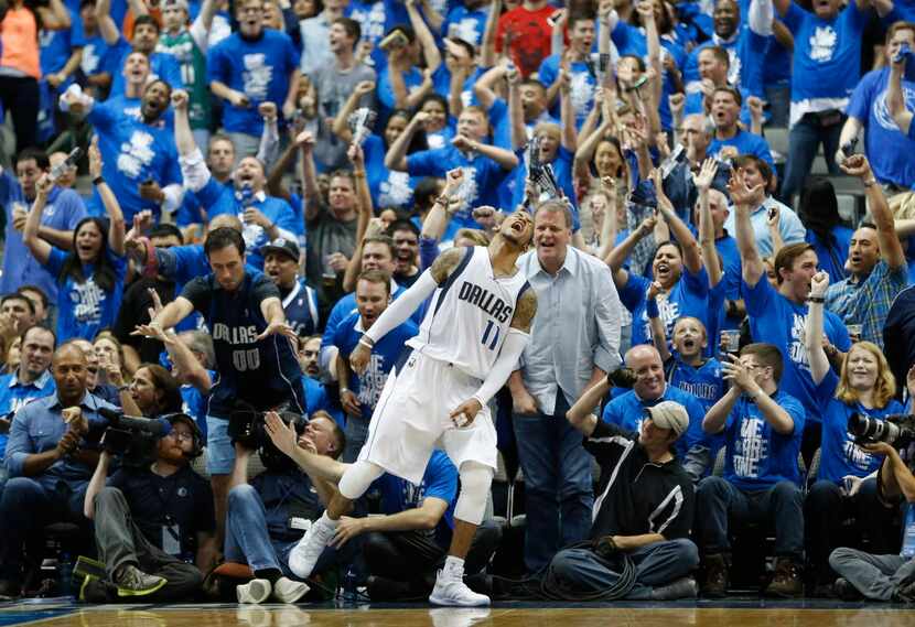 Dallas Mavericks guard Monta Ellis (11) celebrates in front of fans after making a basket...