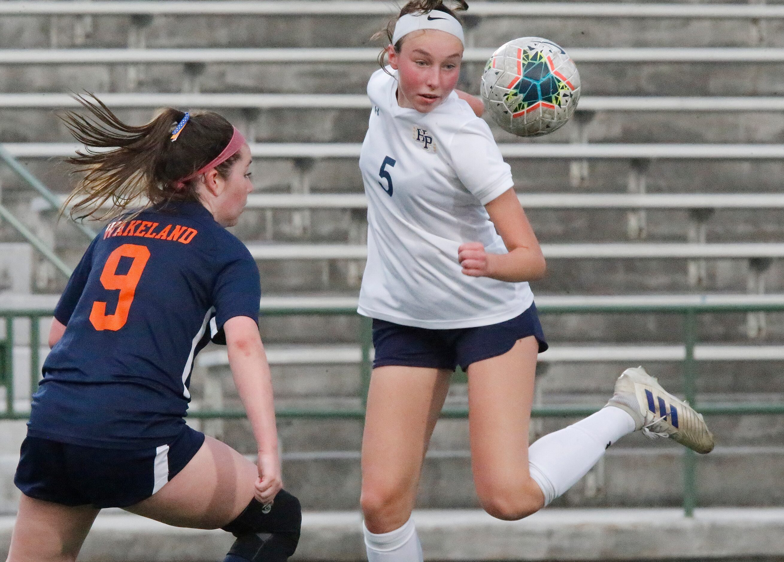 Highland Park midfielder Josie Hart (5) passes the ball as Wakeland midfielder Kayden Amador...