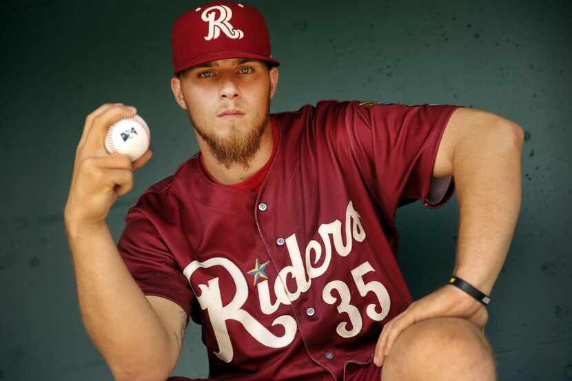 Frisco RoughRiders right handed pitcher Jake Thompson poses for a photo during media day at...