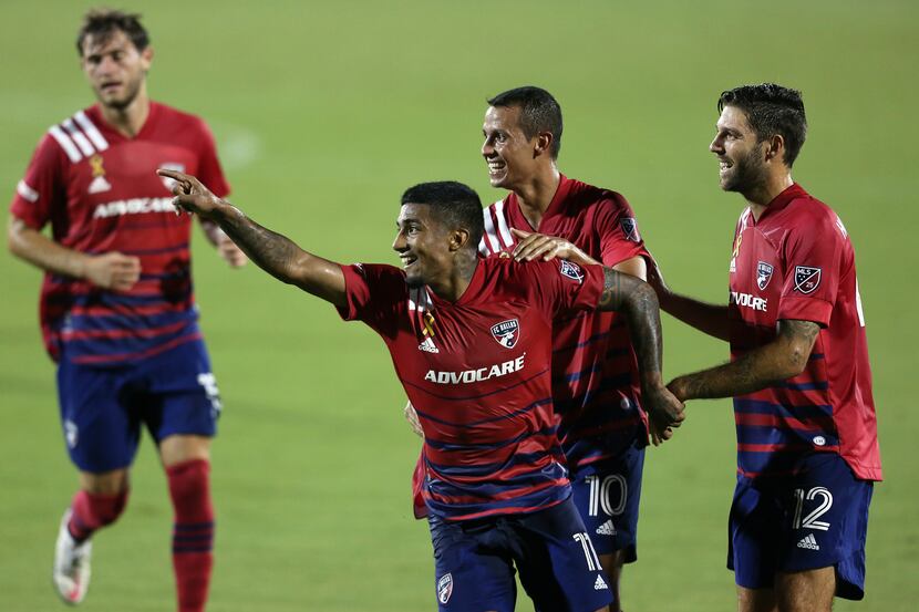 Santiago Mosquera #11 of FC Dallas celebrates with his team mates Andrés Ricaurte #10 and...