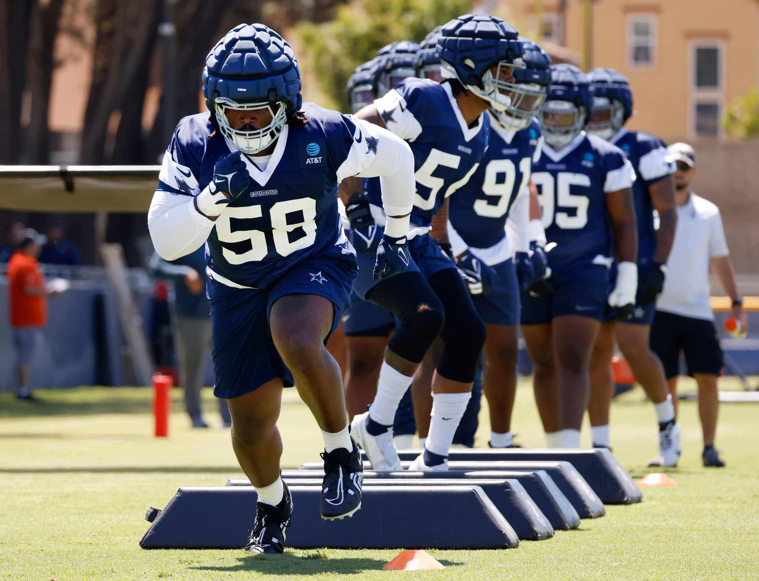 Dallas Cowboys defensive tackle Mazi Smith (58) turns and runs as he completes his footwork...