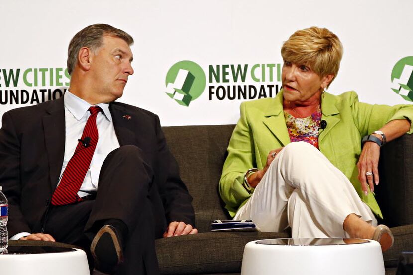  Dallas Mayor Mike Rawlings Â listens as Fort Worth Mayor Betsy Price talks on a panel...