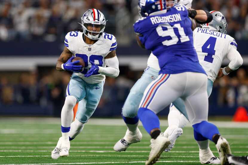 Dallas Cowboys running back Rico Dowdle (23) runs the ball during the first half of an NFL...