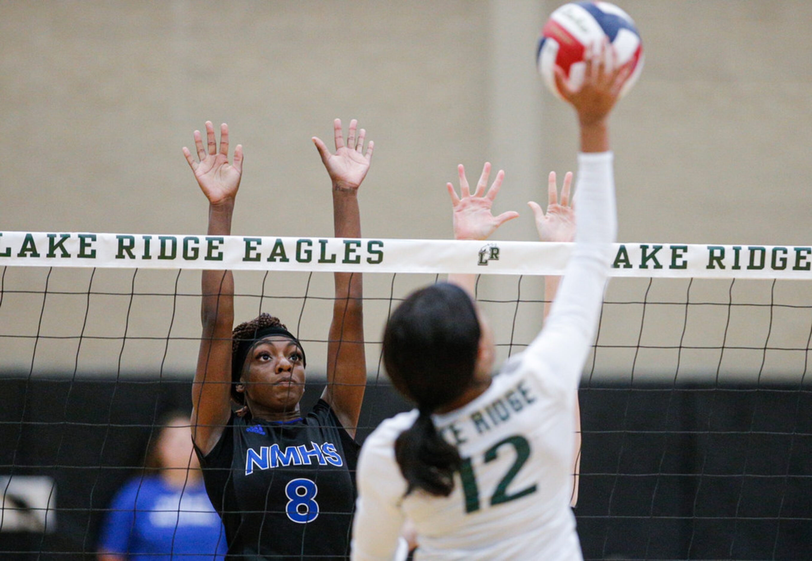 Mansfield Lake Ridge junior Caiya Artis (12) spikes the ball as North Mesquite senior Kayla...