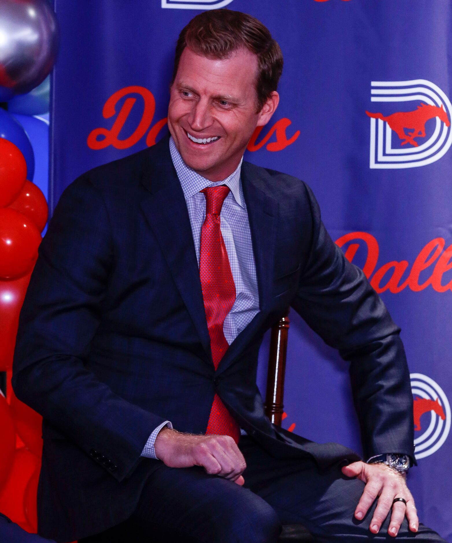 Southern Methodist University's head football coach, Rhett Lashlee sits at a news conference...