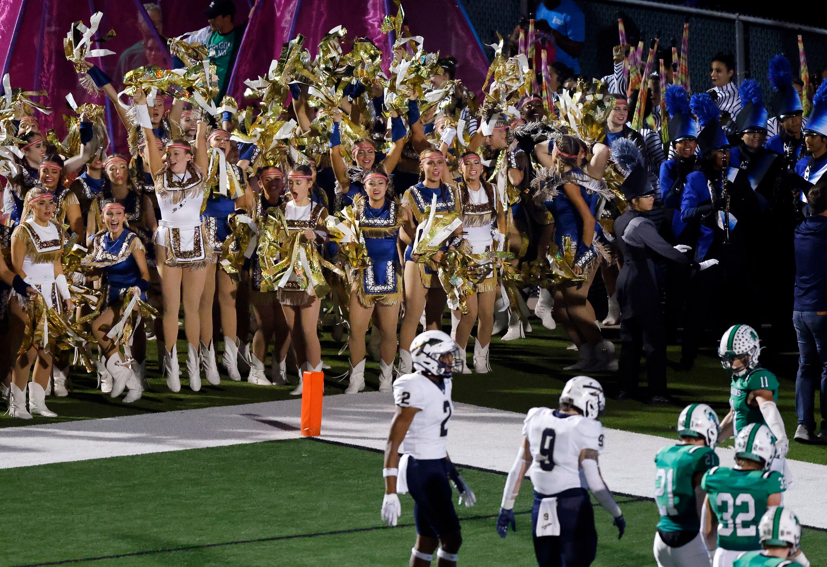 The Keller High Indians drill team cheers a second quarter touchdown against Southlake...