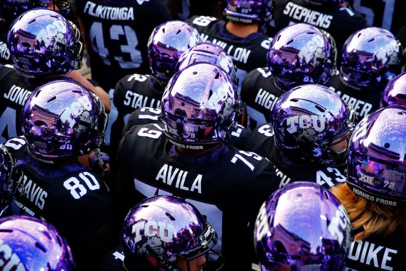 TCU players huddle at Amon G. Carter Stadium in Fort Worth, Thursday, October 11, 2018. (Tom...